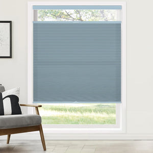 Blue top-down bottom-up cellular honeycomb shade: on a window
