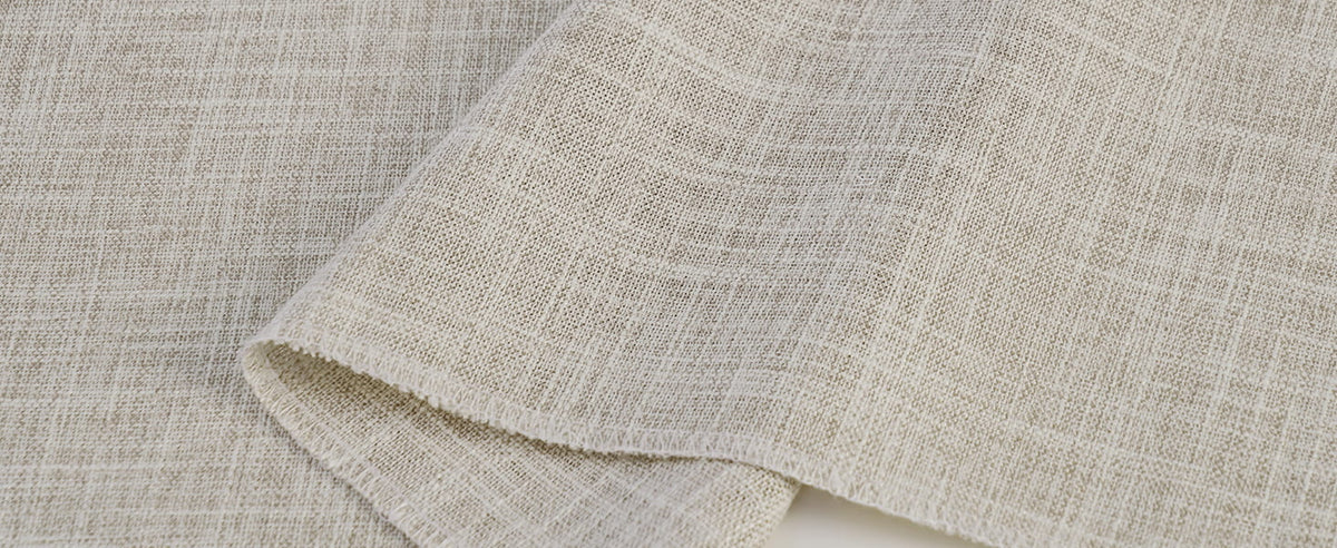 Beige textured Roman shade fabric close-up
