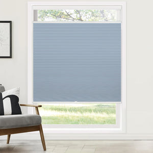 Blue top-down bottom-up cellular honeycomb shade: on a window