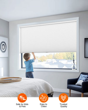 White cellular honeycomb shade: cordless lift operation