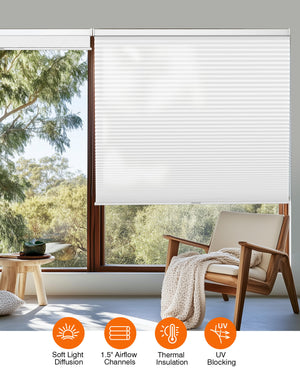 White cellular honeycomb shade: in a furnished room