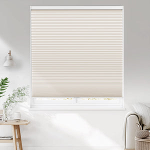 Cream cellular honeycomb shade: on a window