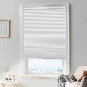 White cellular honeycomb shade: in a furnished room