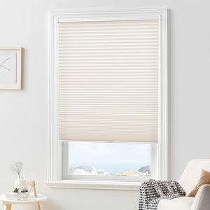 Cream cellular honeycomb shade: in a furnished room