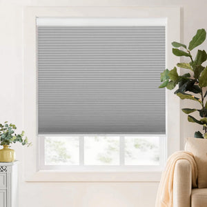 Gray cellular honeycomb shade: on a window