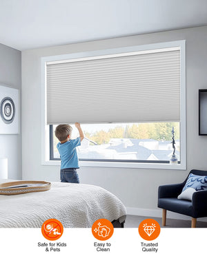 Gray cellular honeycomb shade: cordless lift operation