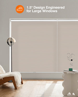 Taupe cellular honeycomb shade: in a furnished room