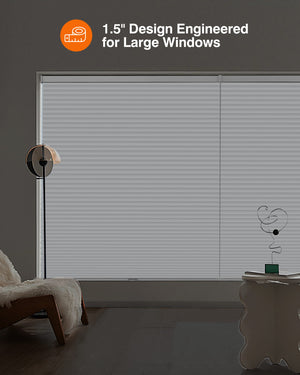 White cellular honeycomb shade: in a furnished room
