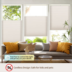 Beige top-down bottom-up no-drill cellular honeycomb shade: above a window seat