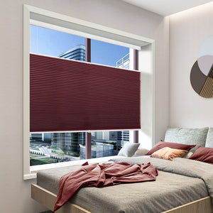 Burgundy top-down bottom-up cellular honeycomb shade: in a bedroom