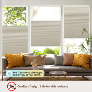 Beige top-down bottom-up no-drill cellular honeycomb shade: above a window seat