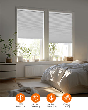 Gray cellular honeycomb shade: in a furnished room
