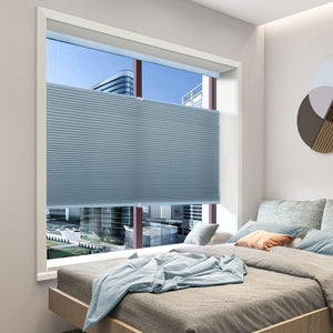 Blue top-down bottom-up cellular honeycomb shade: in a bedroom