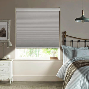 Gray cellular honeycomb shade: in a bedroom