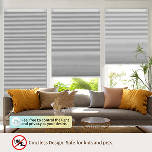 Light gray no-drill cellular honeycomb shade: above a window seat