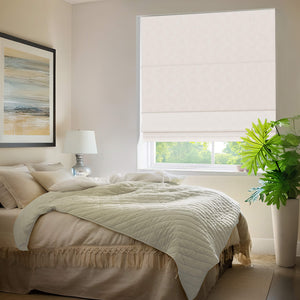 Cream Roman shade: in a bedroom