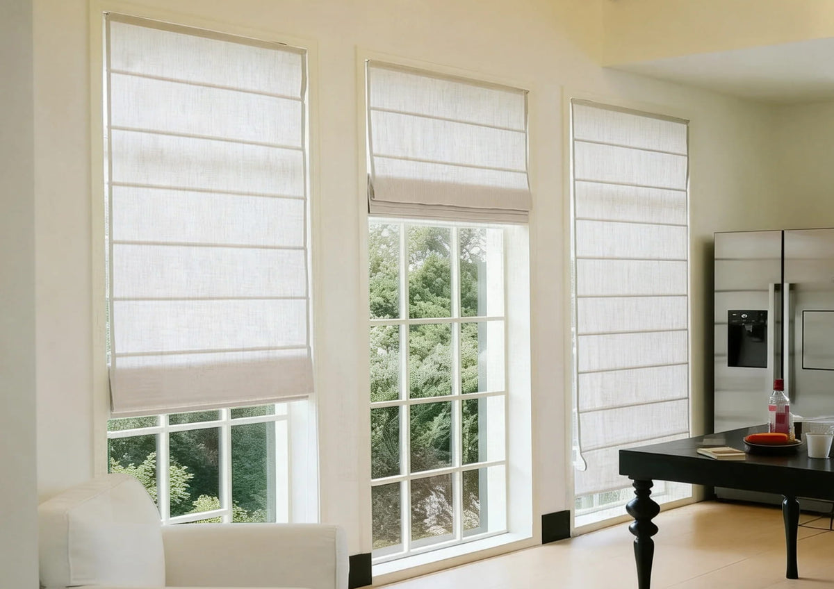 White Roman shades in a bright living room