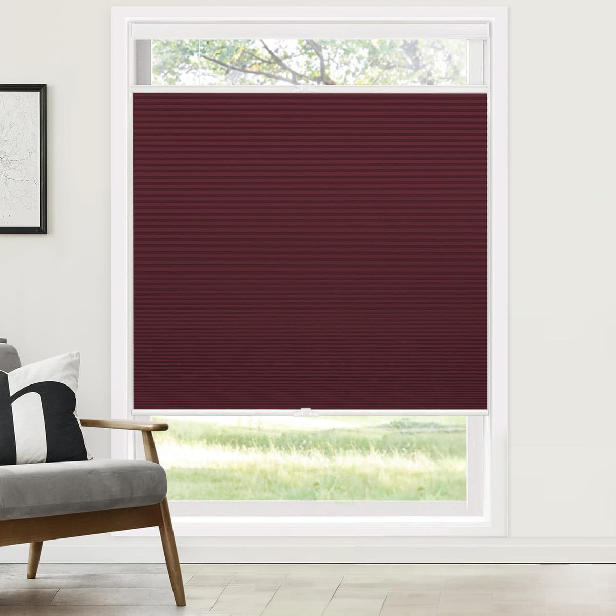 Burgundy top-down bottom-up cellular honeycomb shade: on a window