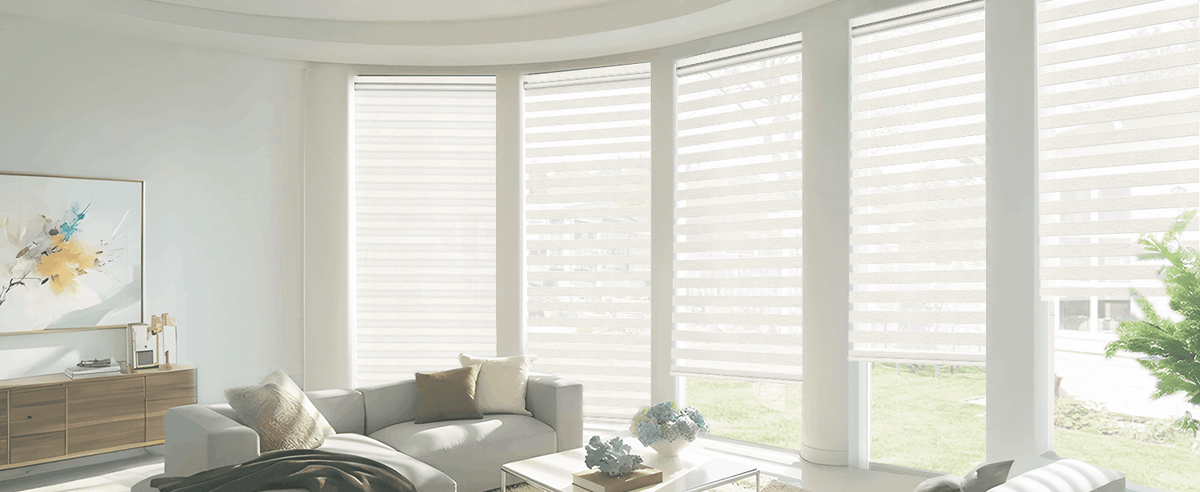 White zebra blinds on living room bay windows