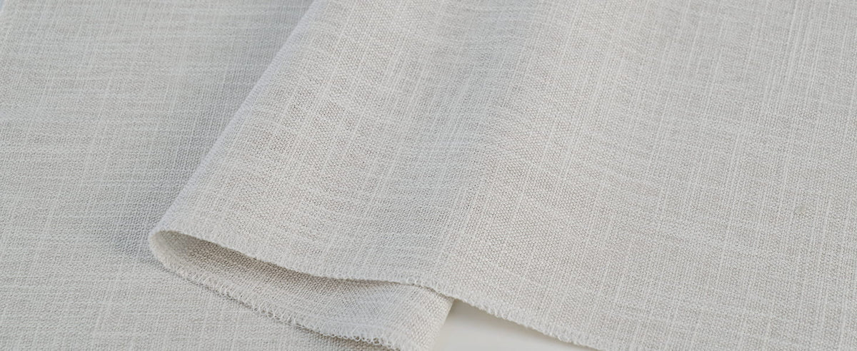 Pale Roman shade fabric weave close-up