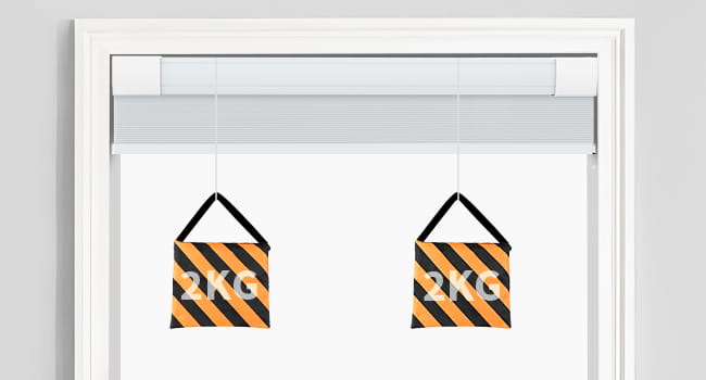 Top-down bottom-up cellular shade headrail shown with hanging weights