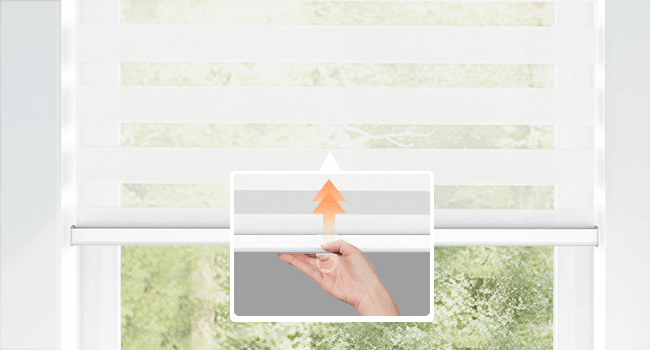Hand raising and lowering a cordless zebra blind