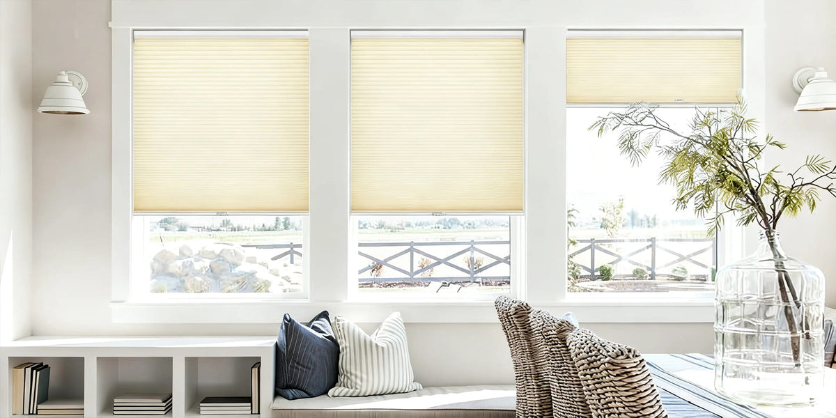 Yellow cellular shades on paired windows
