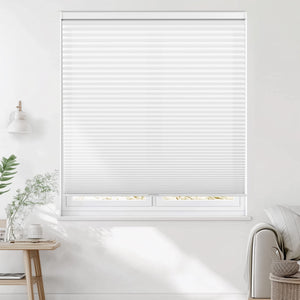White cellular honeycomb shade: on a window