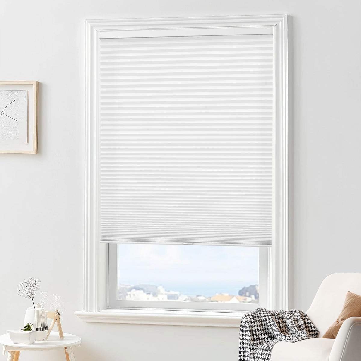 White cellular honeycomb shade: in a furnished room