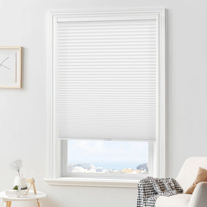 White cellular honeycomb shade: in a furnished room