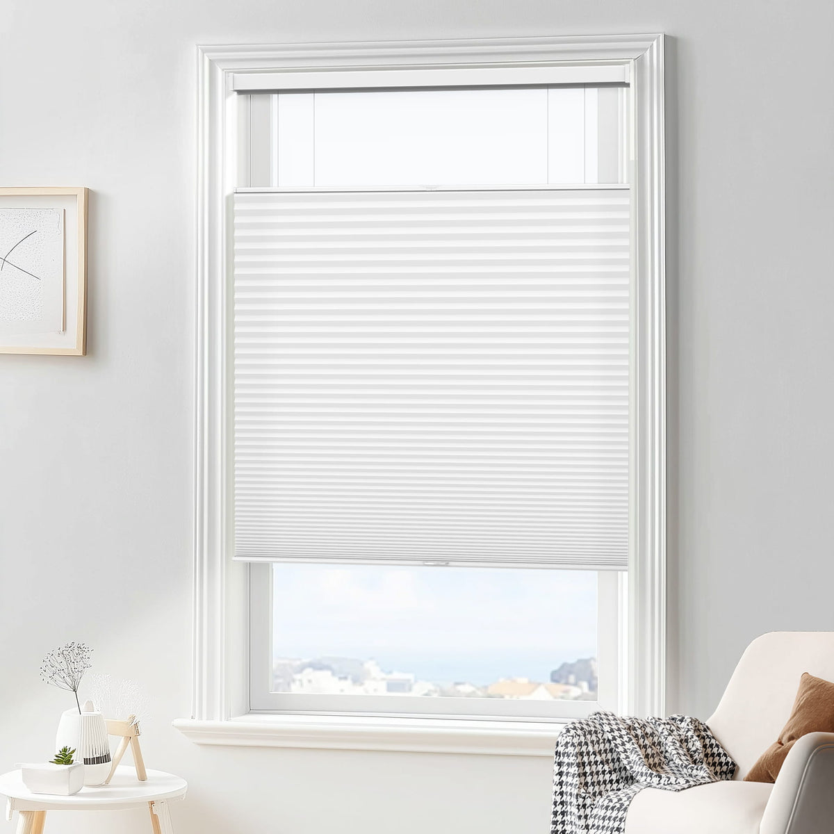 White top-down bottom-up cellular honeycomb shade: in a furnished room