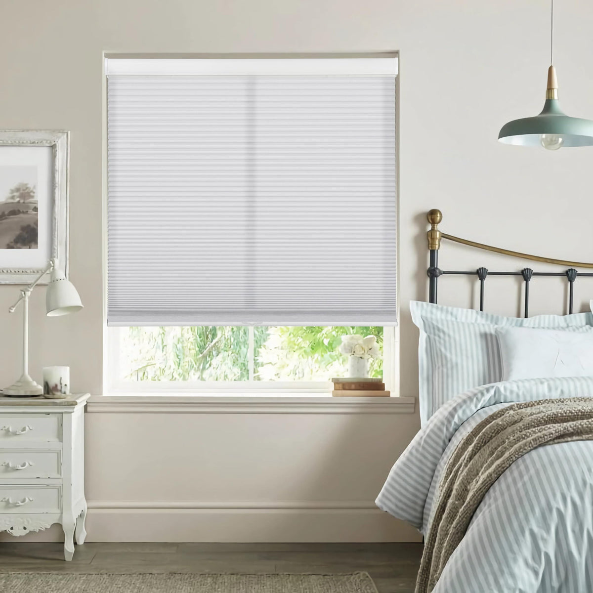 White cellular honeycomb shade: in a bedroom
