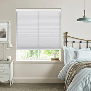 White cellular honeycomb shade: in a bedroom