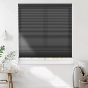 Black cellular honeycomb shade: on a window