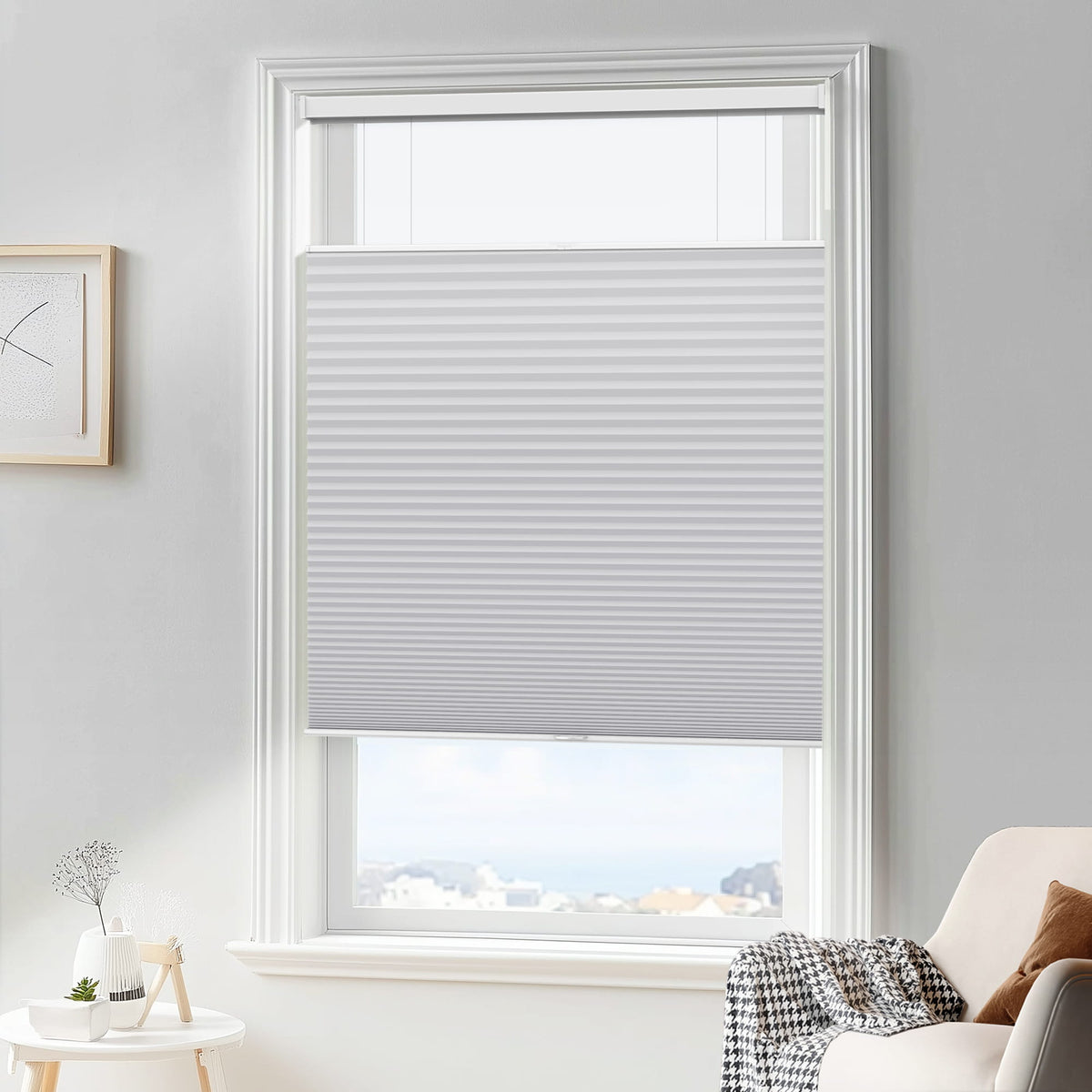 Gray top-down bottom-up cellular honeycomb shade: in a furnished room