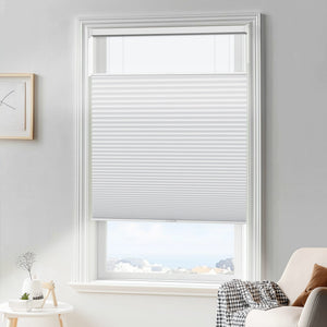 White top-down bottom-up cellular honeycomb shade: in a furnished room