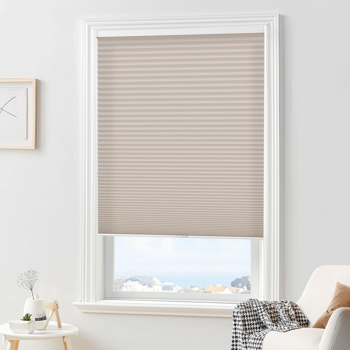 Taupe cellular honeycomb shade: in a furnished room