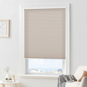 Taupe cellular honeycomb shade: in a furnished room