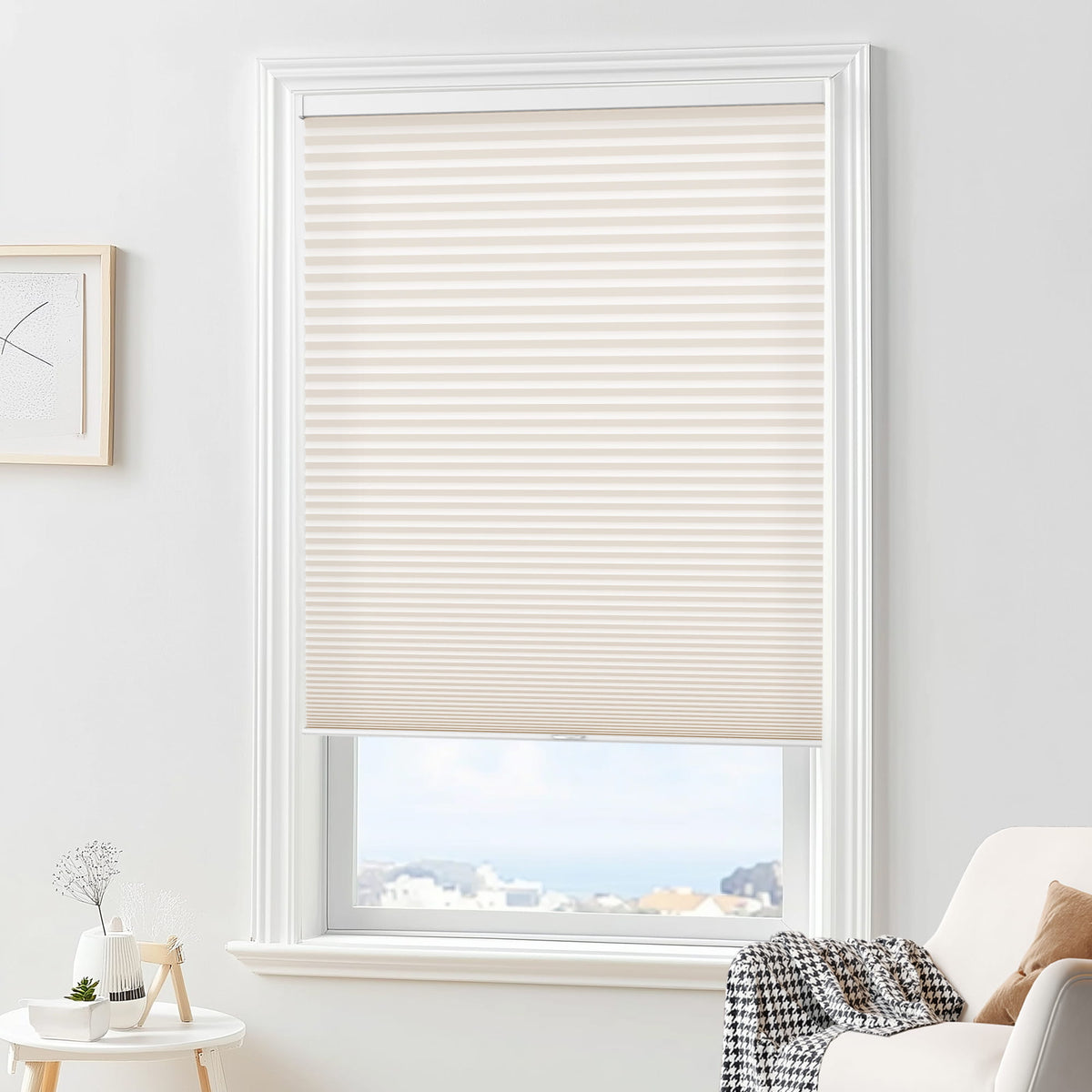 Cream cellular honeycomb shade: in a furnished room