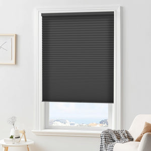 Black cellular honeycomb shade: in a furnished room