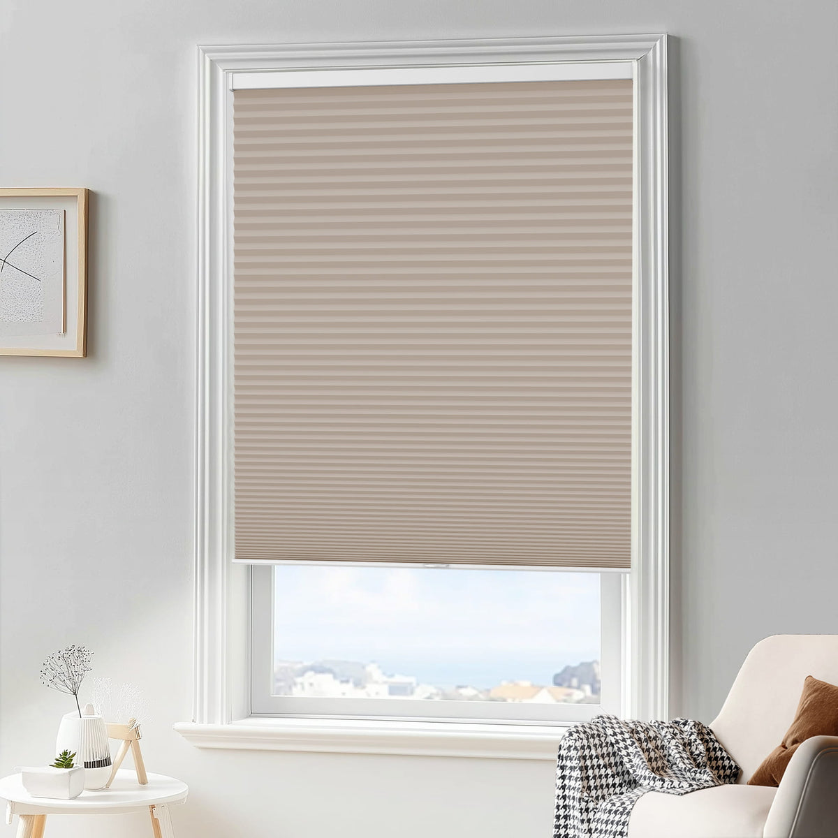 Taupe cellular honeycomb shade: in a furnished room