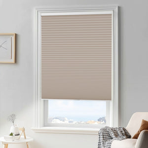 Taupe cellular honeycomb shade: in a furnished room