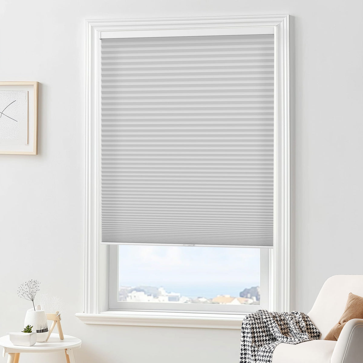 Gray cellular honeycomb shade: in a furnished room