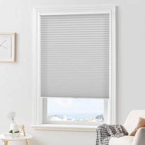 Gray cellular honeycomb shade: in a furnished room