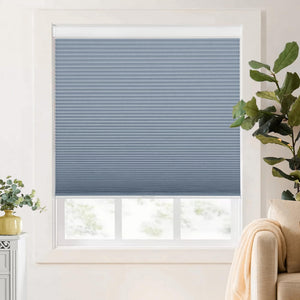 Blue cellular honeycomb shade: on a window