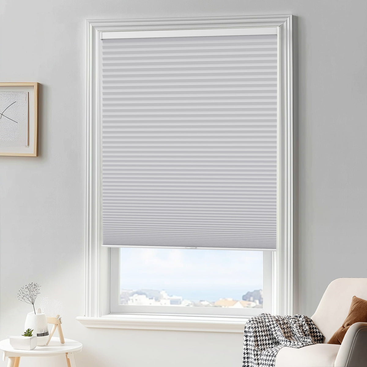 Gray cellular honeycomb shade: in a furnished room