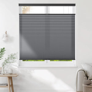 Dark gray top-down bottom-up cellular honeycomb shade: on a window