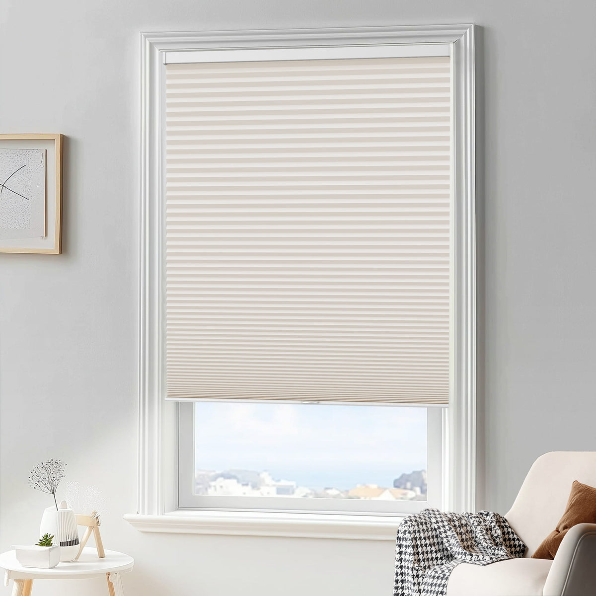 Cream cellular honeycomb shade: in a furnished room