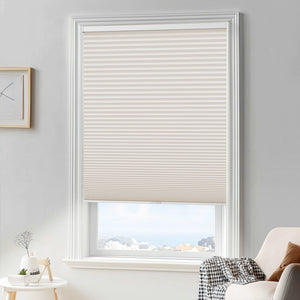 Cream cellular honeycomb shade: in a furnished room