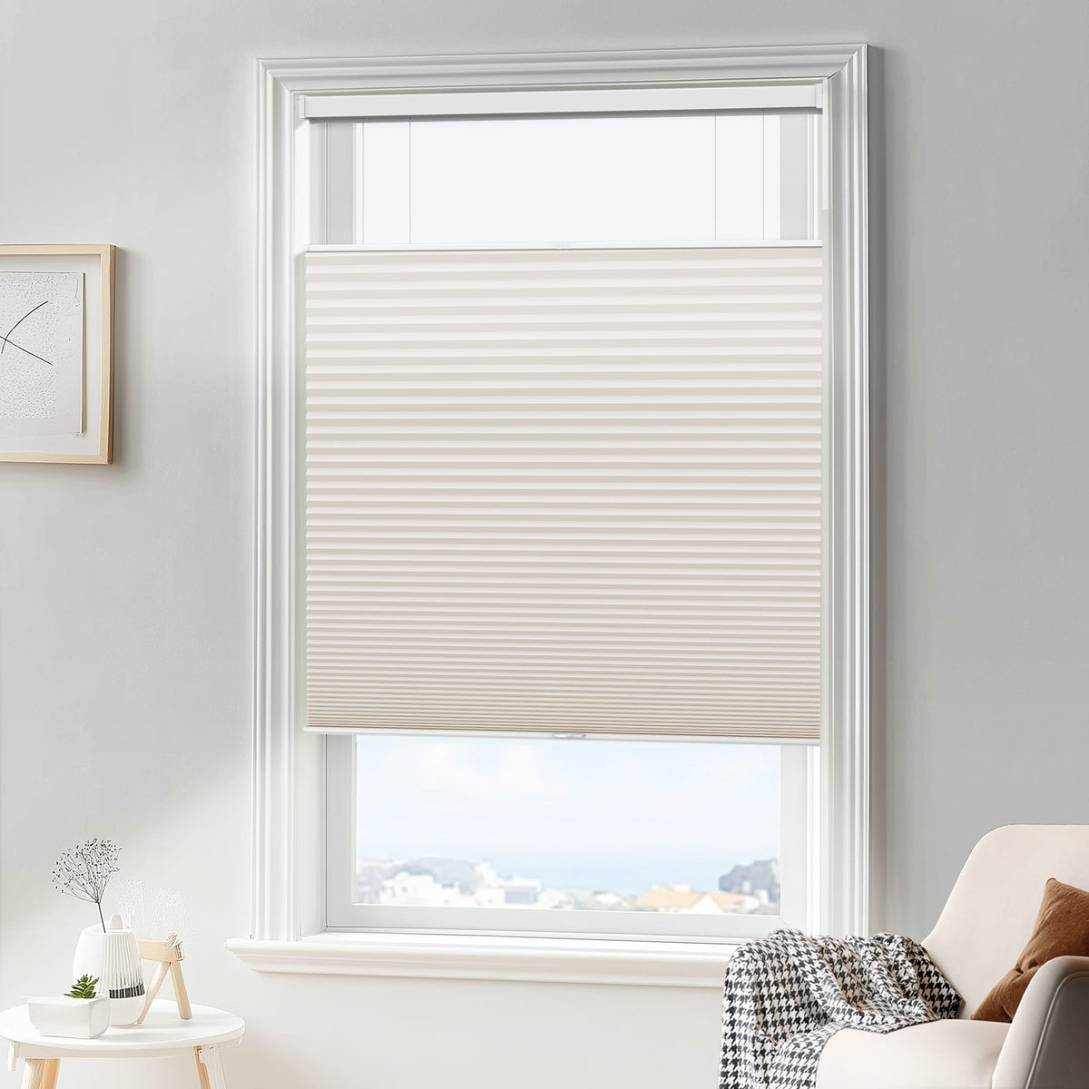 Cream top-down bottom-up cellular honeycomb shade: in a furnished room